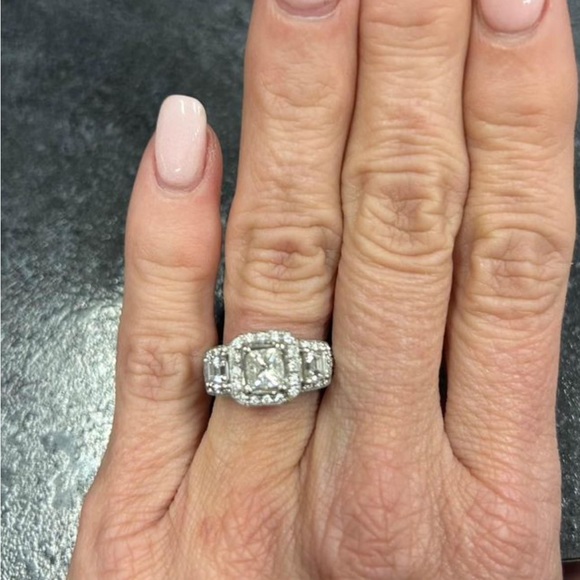 Engagement ring missing two tiny stones $100 to replace can barely see